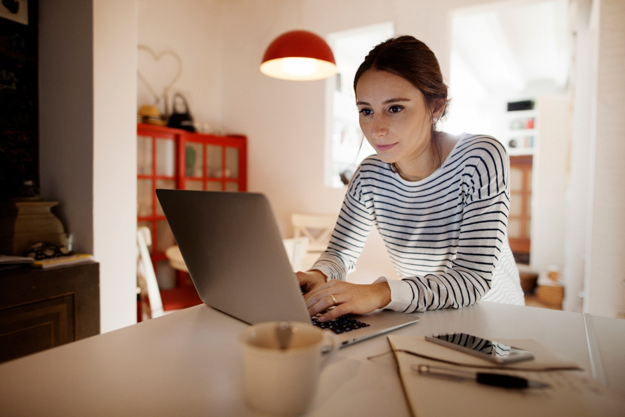 Person watching a webinar on a laptop.